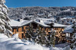 Nestled in a snow-covered mountainside, this stunning chalet offers breathtaking views and luxurious accommodations.