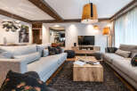 This stunning living room boasts a spacious and open layout, featuring two plush grey sofas perfect for relaxation.