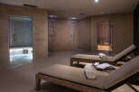 Relax and rejuvenate in our luxurious spa, featuring a tranquil sauna, invigorating showers, and comfortable lounge chairs perfect for unwinding after your spa treatment.