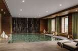 Indulge in the ultimate relaxation experience in this luxurious indoor pool and spa.