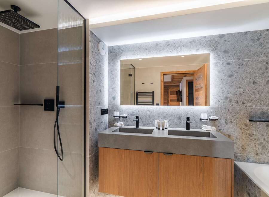 Step into luxury with this stunning bathroom featuring a sleek, modern design.