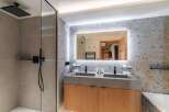 Step into luxury with this stunning bathroom featuring a sleek, modern design.