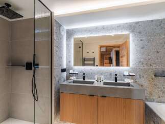 Step into luxury with this stunning bathroom featuring a sleek, modern design.