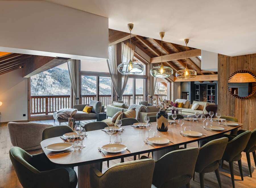 Experience luxury living in this stunning property, featuring a spacious dining area perfect for entertaining.