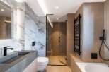 Step into luxury with this stunning modern bathroom.