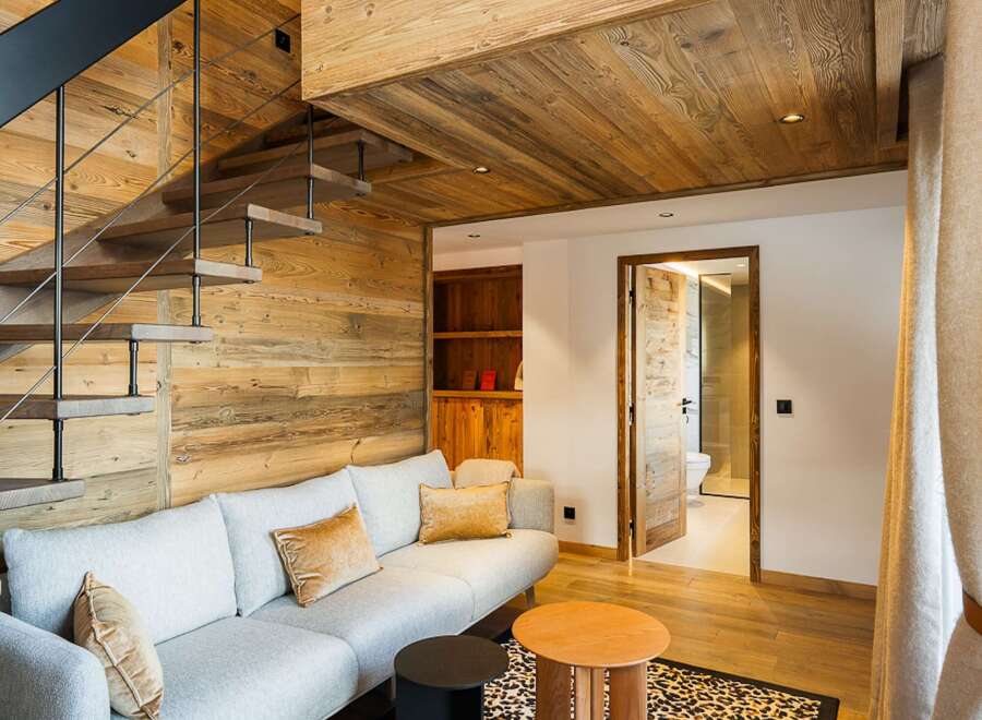 Experience luxury living in this stunning property featuring a unique wooden interior design.