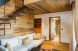 Experience luxury living in this stunning property featuring a unique wooden interior design.