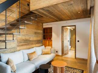 Experience luxury living in this stunning property featuring a unique wooden interior design.