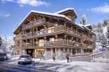 This stunning chalet-style apartment building boasts a prime location in a snow-covered mountain setting.