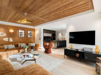 Experience luxury living in this stunning property, featuring a beautifully designed living area with a cozy sofa and a modern entertainment unit.