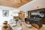 Experience luxury living in this stunning property, featuring a spacious dining area perfect for entertaining.