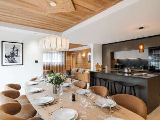 Experience luxury living in this stunning property, featuring a spacious dining area perfect for entertaining.