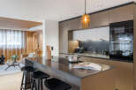 This stunning kitchen boasts modern design and high-end appliances, perfect for culinary enthusiasts.