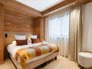 Experience the warmth and charm of this beautifully designed bedroom.