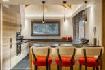 This stunning kitchen boasts a modern design with a touch of rustic charm.