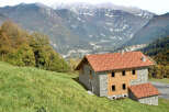 Nestled in the heart of the mountains, this charming stone house offers a serene escape.