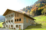 Discover the charm of this stunning stone house nestled in a picturesque mountain setting.