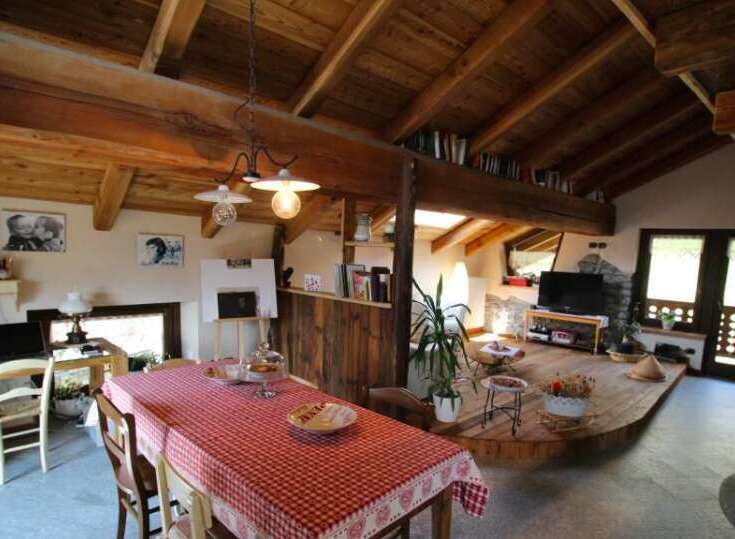 This charming property boasts a rustic interior with exposed wooden beams and a cozy atmosphere.
