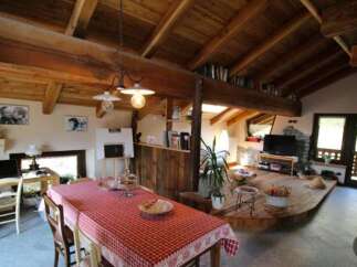 This charming property boasts a rustic interior with exposed wooden beams and a cozy atmosphere.