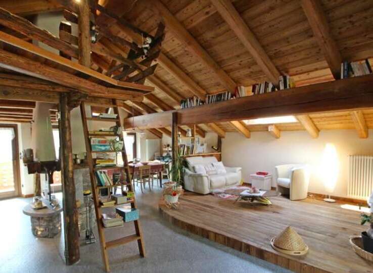 Discover the charm of this rustic home, featuring stunning wooden beams and a cozy loft space.