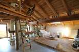 Discover the charm of this rustic home, featuring stunning wooden beams and a cozy loft space.