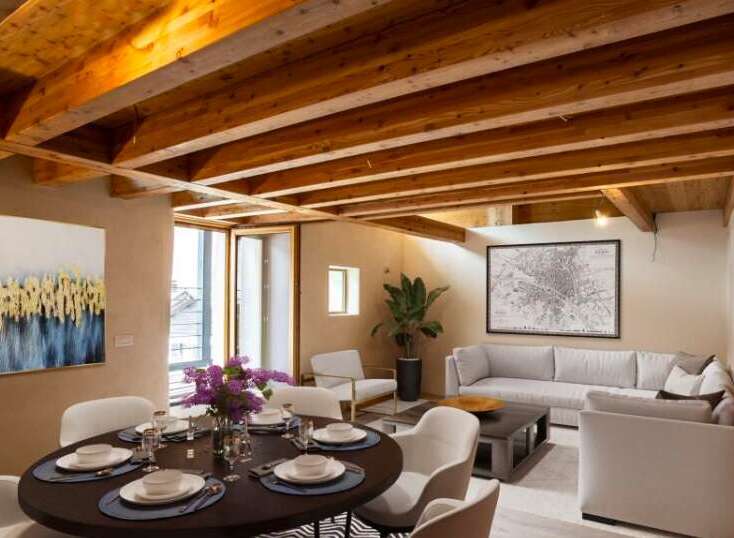 Discover the charm of this stunning property, featuring a beautifully designed interior with exposed wooden beams that add warmth and character.