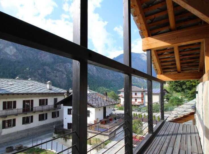 Enjoy breathtaking mountain views from this charming balcony.