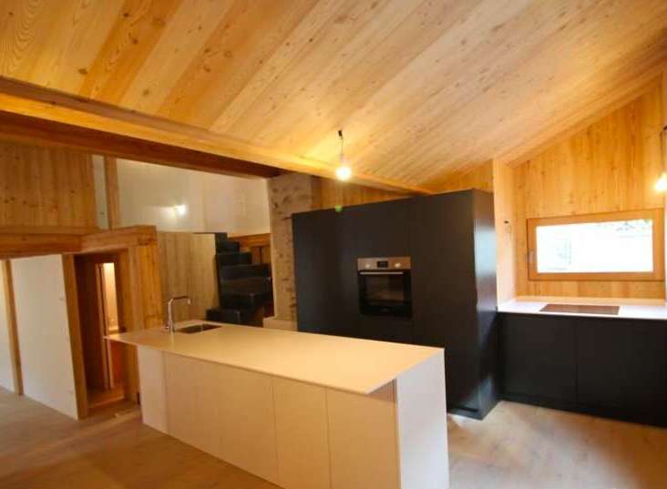 This stunning kitchen boasts a modern design with a warm, inviting atmosphere.
