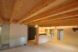 This stunning property boasts a beautifully designed interior with exposed wooden beams that add warmth and character.