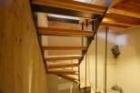 This stunning property boasts a unique staircase design, blending wood and metal for a modern aesthetic.