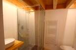 Discover a modern bathroom with a sleek glass shower enclosure.