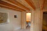 This charming property boasts a stunning wooden ceiling and walls, creating a warm and inviting atmosphere.