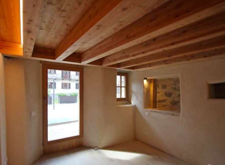 Discover the charm of this rustic property, featuring exposed wooden beams that add warmth and character.