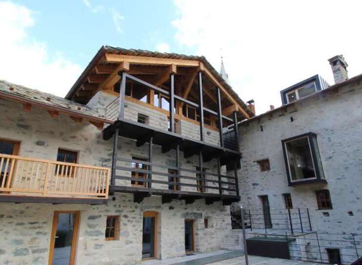 Discover the charm of this unique property featuring stunning stone architecture and inviting balconies.
