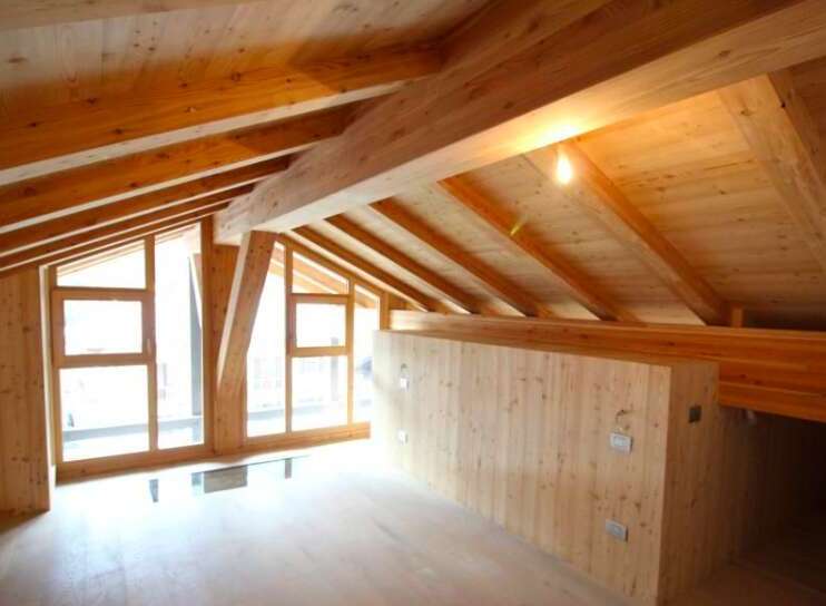 Discover the charm of this stunning wooden interior, featuring a beautifully crafted ceiling with exposed beams.