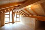 Discover the charm of this stunning wooden interior, featuring a beautifully crafted ceiling with exposed beams.