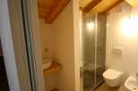 Discover a stylish bathroom with a modern shower and sleek toilet.
