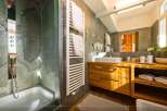 This luxurious bathroom features a modern design with a touch of nature.