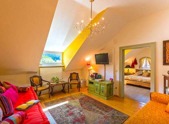 Discover the charm of this cozy attic room, perfect for a relaxing getaway.