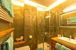 This stunning bathroom boasts a modern design with a touch of rustic charm.