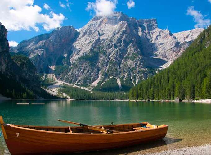 Explore the breathtaking beauty of this stunning lake surrounded by majestic mountains.
