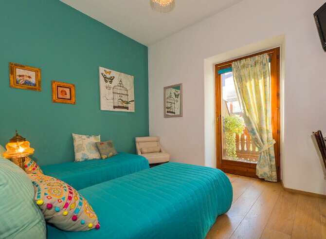 This charming bedroom features two comfortable twin beds, perfect for a relaxing stay.