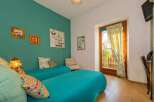 This charming bedroom features two comfortable twin beds, perfect for a relaxing stay.