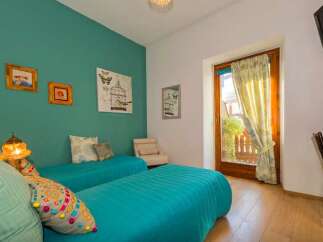 This charming bedroom features two comfortable twin beds, perfect for a relaxing stay.