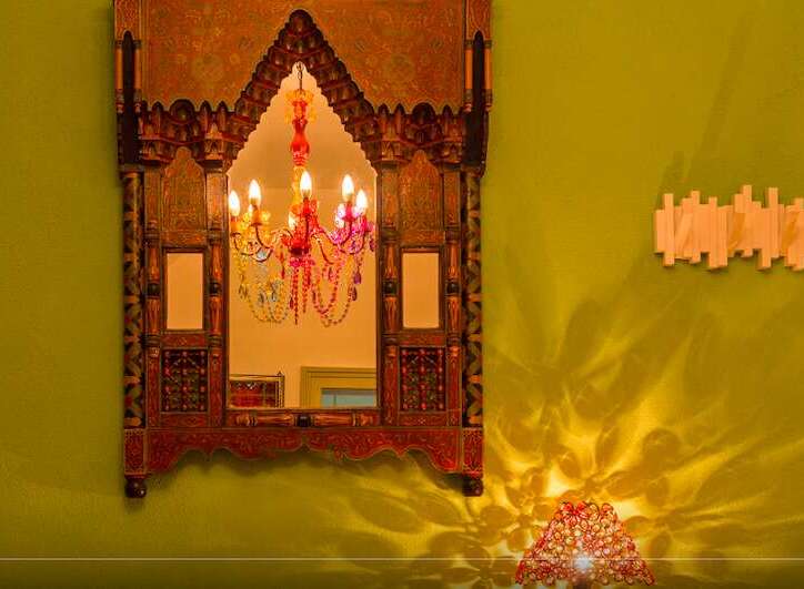 This stunning property boasts a unique and ornate mirror, adding a touch of exotic elegance to the space.