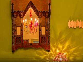 This stunning property boasts a unique and ornate mirror, adding a touch of exotic elegance to the space.