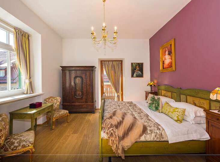 Step into a charming bedroom with a touch of vintage elegance.