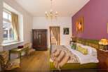 Step into a charming bedroom with a touch of vintage elegance.