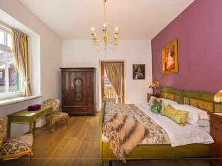 Step into a charming bedroom with a touch of vintage elegance.