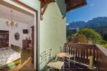 Enjoy breathtaking mountain views from this charming balcony.